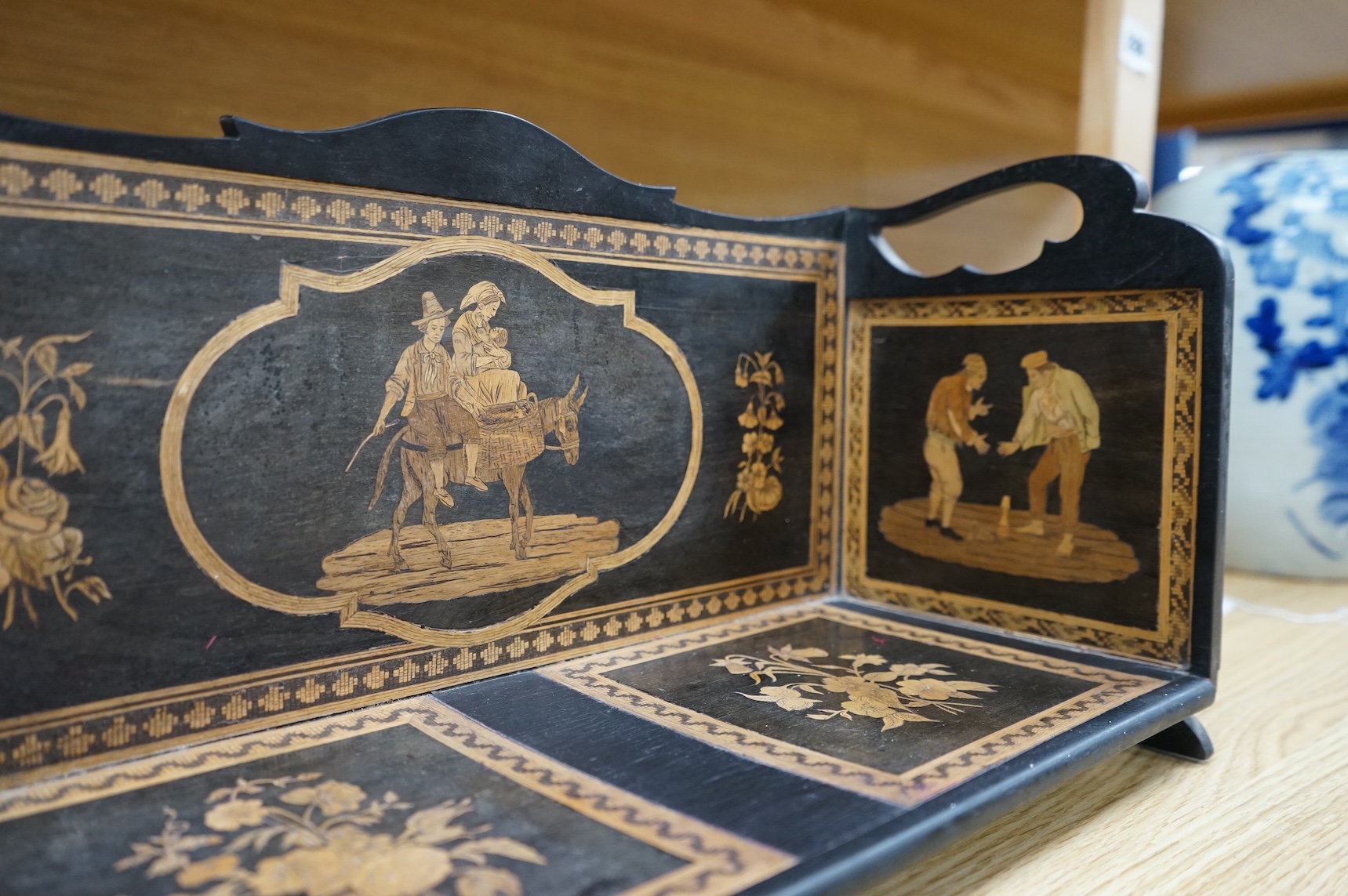 A late 19th century Sorrento ware book stand, 37.5cm wide x 20cm high